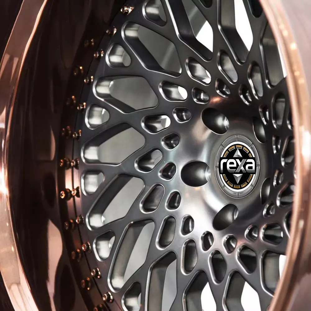 Close-up of brushed gunmetal organic mesh face and bronze hardware